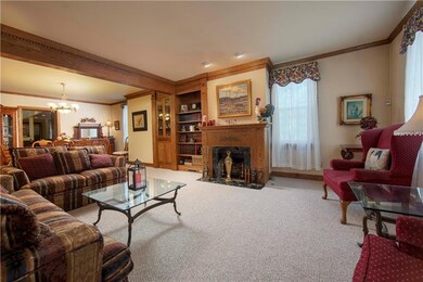 Formal Living Room with gas fireplace open to the 