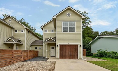 Traditional home featuring driveway and a garage