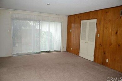 Another view of living room. Sliding patio door le