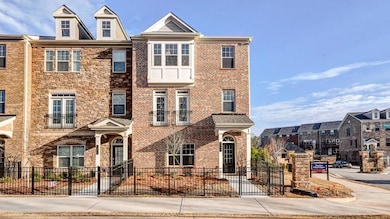 View of property with fence and brick siding