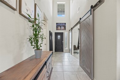 Stunning custom barn door adds casual elegance tha