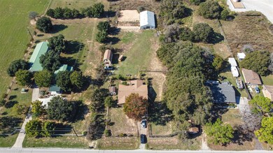 Birds eye view of property featuring a rural view