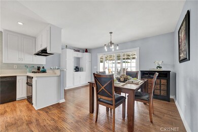 Dining Area with Coffee Nook in the Corner. Custom Sliding Doors to Patio!