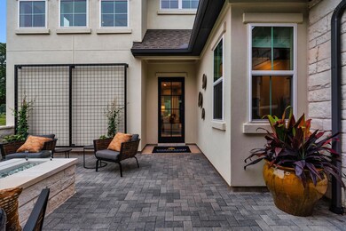 Property entrance with a patio area, stucco sidin