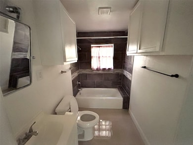 Bathroom featuring vanity and shower / washtub combination