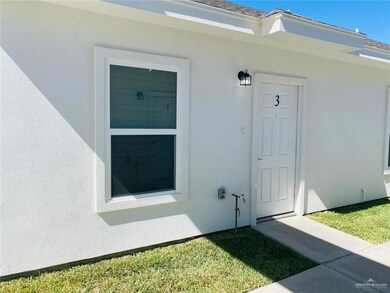 Doorway to property with stucco siding