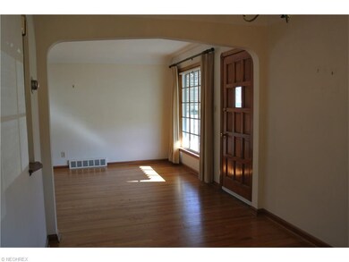 Carpeting recently removed to reveal hardwood flooring in Living Room, Dining Room, Hall, and 2 Bedrooms.