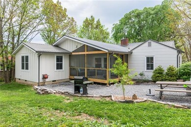 Rear of home with 200 sq foot screened deck overlo