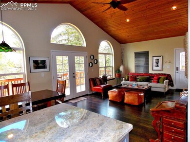 Dining space with high vaulted ceiling, french doo
