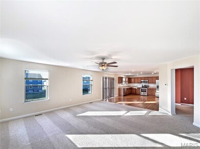 Unfurnished living room with light carpet, ceiling fan, and recessed lighting