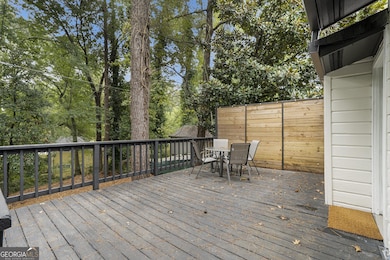 Back Deck overlooks a peaceful wooded backdrop ideal for Al Fresco Dining or quiet evenings all while enjoying the privacy of a Fully Fenced Backyard