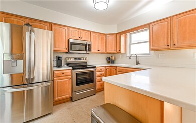 Kitchen fully equipped with stainless steel applia