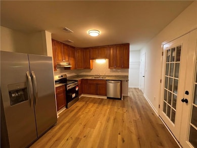 Kitchen with appliances with stainless steel finis
