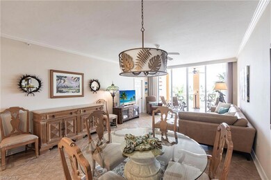 Dining space featuring expansive windows, ornamental molding, light tile patterned flooring, and ceiling fan