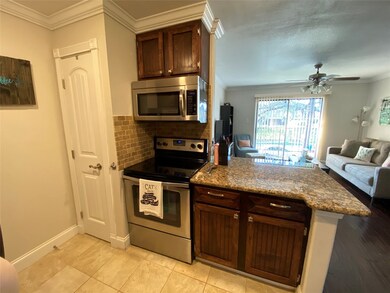 Another view of kitchen with stainless appliances,
