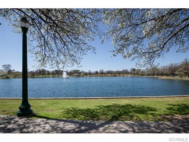 Another view of the lake and sidewalk.