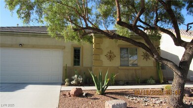 View of front facade featuring concrete driveway,
