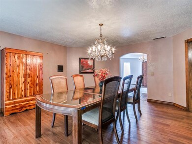 Dining area featuring a notable chandelier, and ha