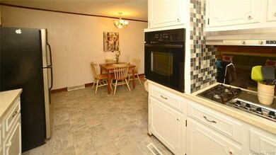 Kitchen & view of adjoining dining area.