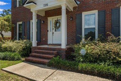 Entrance to property with brick siding