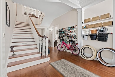 Foyer entrance featuring wood-type flooring