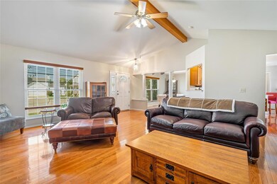 Great room with a view into the dining room and ki