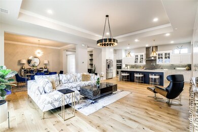 Open concept living iwth beautiful wood flooring a