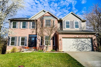 Front view of house. Brick exterior with Vinyl siding.