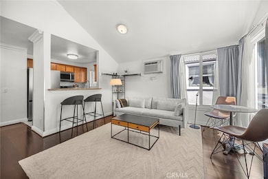 Spacious feel with high ceilings and plenty of natural light in this living room.
