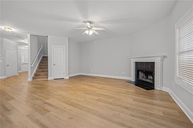 Unfurnished living room featuring a tile fireplace