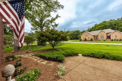 Friendly welcome with this plush green Zoysia lawn.
