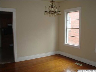 Dining room with door leading to kitchen