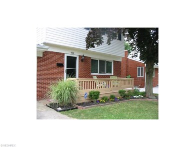 FRONT WITH WOOD DECK, NICELY LANDSCAPED AND ADT AL
