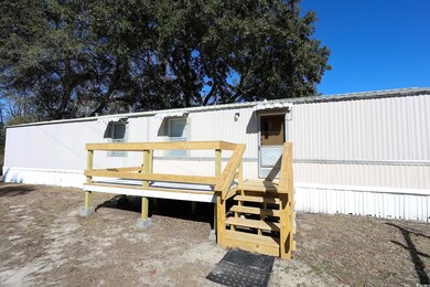 Rear view of property with a deck