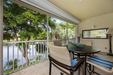 Sunroom / solarium featuring a water view
