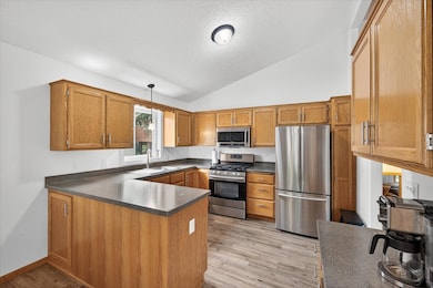 Kitchen with stainless steel appliances, ample storage, and space to prep and cook with ease.