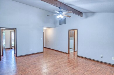 Living room featuring high vaulted ceiling, a ceil