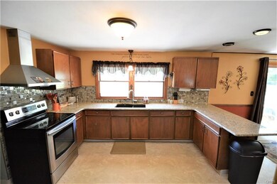 Beautifully updated kitchen features granite count