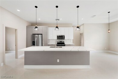 Kitchen featuring a sink, stainless steel applianc
