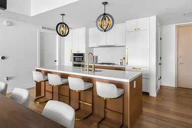 Kitchen with a kitchen bar, hardwood / wood-style