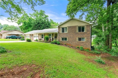 Split-level home with covered porch, brick siding