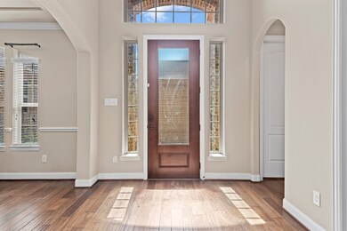 The open entryway beckons you with its seamless blend of space, light, and design, setting the tone for the entire home.