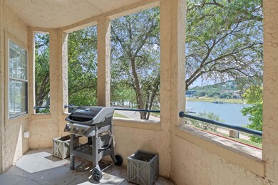 Sunroom featuring a water view