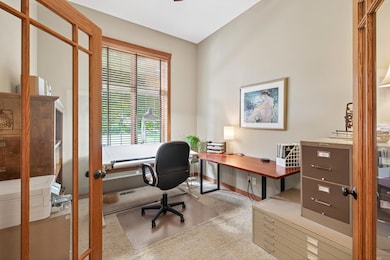 Main level office space or could be a den, great light