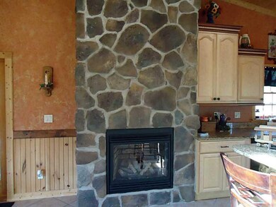 Great Room. Floor to ceiling gas fireplace. Turns 
