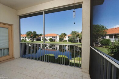 screened balcony with water and fountain view