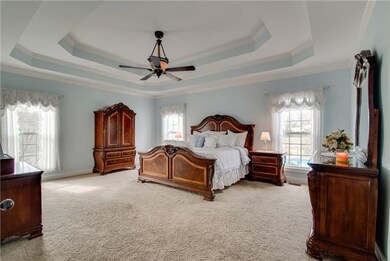 Extra large master bedroom has double tray ceiling and an upgraded large fan. It has a double intrance to the master bathroom. Dont want to disturb your wife? No problem, you have your own entrance to the man side of the master bath. 