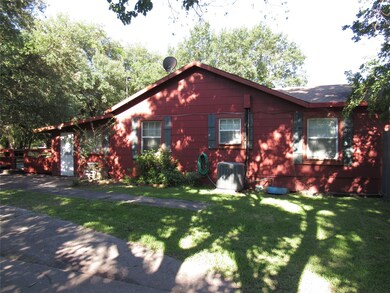 Left side of the house.