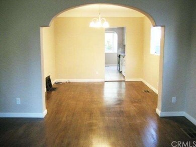 Beautiful archway leading to the dining room and kitchen.