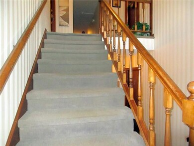 Stairs from the entry to the second...